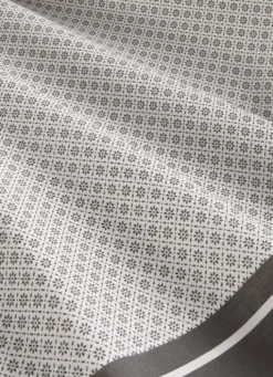 NAPPE EN COTON ENDUITE MOTIF FANTAISIE BLANC/GRIS