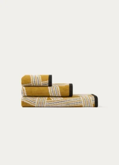 SERVIETTE INVITÉ JACQUARD MOTIFS GÉOMÉTRIQUES JAUNE OCRE